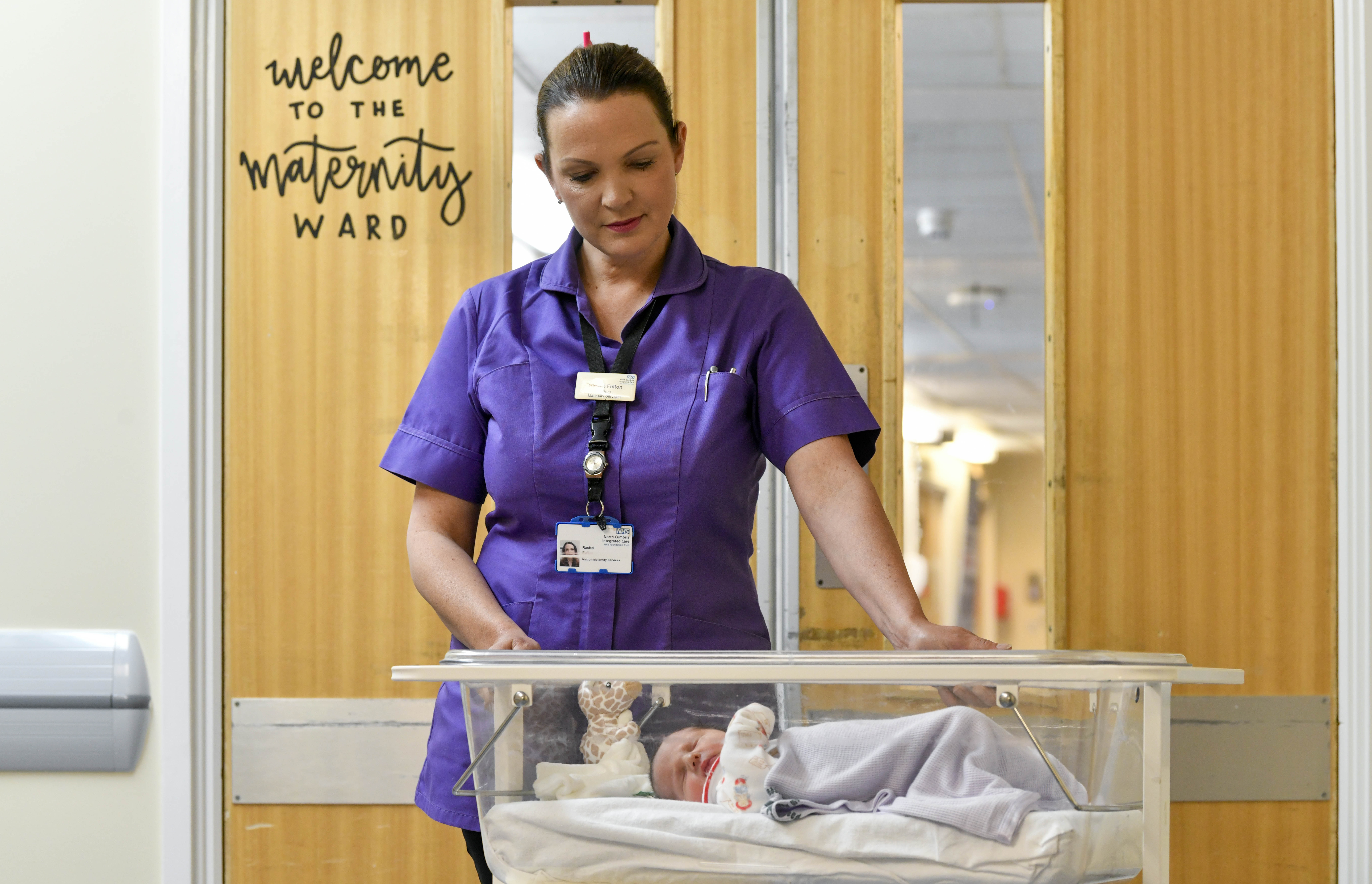 Matron Rachel Fulton Looking At Baby, NCIC