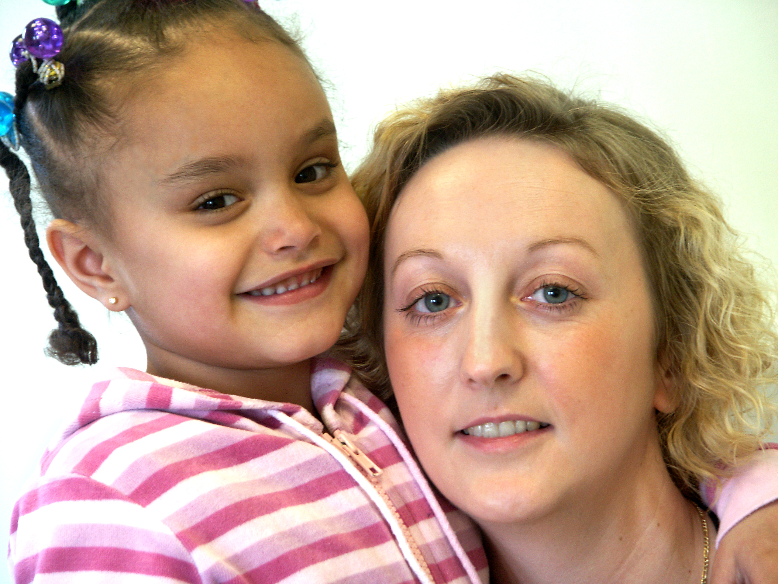 Adult and child looking at camera